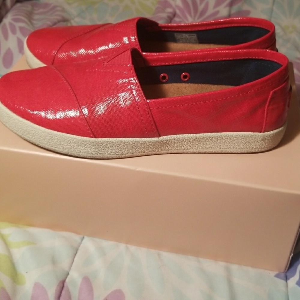 TOMS red vinyl slip ons